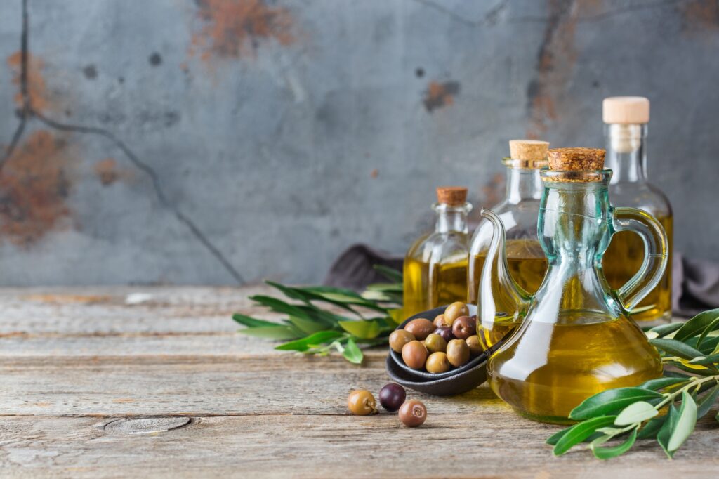 Assortment of fresh organic extra virgin olive oil in bottles